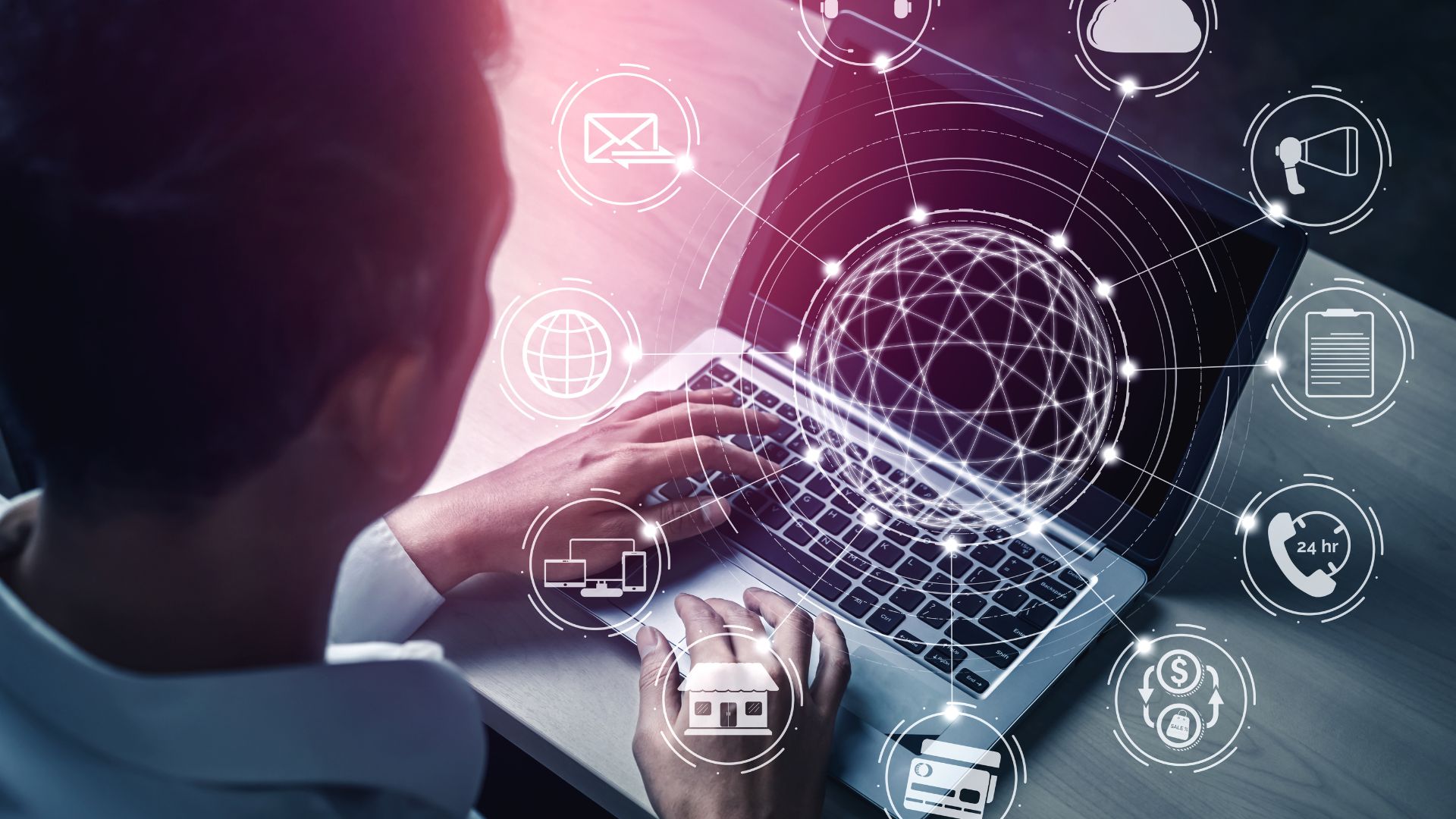 Professional using a laptop with digital communication and cloud technology icons overlayed.
